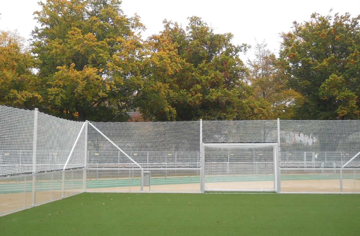 Stationary soccer court with glazed wall elements by artec Sportgeräte